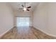 Spacious living room featuring hardwood floors and access to a pool view at 4475 Se 48Th Place Rd, Ocala, FL 34480