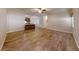 Open concept living room and kitchen with wood floors at 4475 Se 48Th Place Rd, Ocala, FL 34480