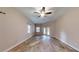 Main bedroom featuring hardwood floors and multiple windows at 4475 Se 48Th Place Rd, Ocala, FL 34480