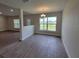 Bright dining room with tile floors and a view from a large window at 4581 Sw 113Th Pl, Ocala, FL 34476