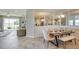 Bright dining room with a wooden table and bench seating at 4748 Nw 39Th Street Rd, Ocala, FL 34482