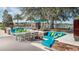 Relaxing poolside patio with seating and beautiful landscaping at 4748 Nw 39Th Street Rd, Ocala, FL 34482