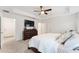 Comfortable bedroom with a dresser and king-size bed at 5050 Sw 91 Pl, Ocala, FL 34476