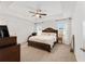 Spacious bedroom with carpeted floor and large bed at 5050 Sw 91 Pl, Ocala, FL 34476