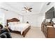 Bright bedroom featuring a king-size bed and ample space at 5050 Sw 91 Pl, Ocala, FL 34476