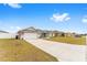 Single story home with two car garage and landscaped yard at 5050 Sw 91 Pl, Ocala, FL 34476