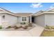 Inviting front entry with blue door and stone accents at 5050 Sw 91 Pl, Ocala, FL 34476