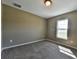 Bright bedroom with neutral walls and carpeted floors at 5485 Nw 57Th Ave, Ocala, FL 34482