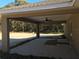 Covered patio with ceiling fan, overlooking backyard at 5652 Nw 59Th Ct, Ocala, FL 34482