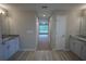 Double vanity bathroom with granite countertops at 6725 Sw 64Th Ave, Ocala, FL 34476