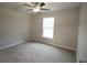 Bright bedroom with ceiling fan and carpet flooring at 6725 Sw 64Th Ave, Ocala, FL 34476