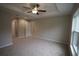 Bright bedroom with ceiling fan and large window at 6725 Sw 64Th Ave, Ocala, FL 34476