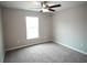 Spacious bedroom featuring a ceiling fan and neutral walls at 6725 Sw 64Th Ave, Ocala, FL 34476