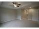 Main bedroom with ceiling fan and access to bathroom at 6725 Sw 64Th Ave, Ocala, FL 34476