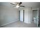 Well-lit bedroom with double door closet and ceiling fan at 6725 Sw 64Th Ave, Ocala, FL 34476