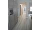 Bright hallway with light gray vinyl flooring at 6725 Sw 64Th Ave, Ocala, FL 34476