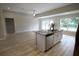 Kitchen island with granite countertop and stainless steel dishwasher at 6725 Sw 64Th Ave, Ocala, FL 34476