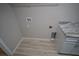 Laundry room with white cabinets and granite at 6725 Sw 64Th Ave, Ocala, FL 34476