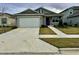 Single-story home with a two-car garage at 7208 Sw 61St Sw Pl, Ocala, FL 34474