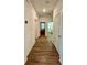 Bright hallway with wood-look floors at 7208 Sw 61St Sw Pl, Ocala, FL 34474