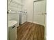 Laundry room with washer, dryer, and shelving at 7208 Sw 61St Sw Pl, Ocala, FL 34474