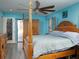 Main bedroom with a wooden post bed, ceiling fan and a large closet at 726 Marion Oaks Ln, Ocala, FL 34473