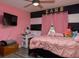 Bedroom with a pink theme, TV, and a ceiling fan at 726 Marion Oaks Ln, Ocala, FL 34473