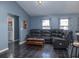 Living room with a leather sectional sofa and tile floors at 726 Marion Oaks Ln, Ocala, FL 34473