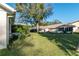 Exterior view of the homes and grassy backyard in the community at 8569 Sw 92Nd Ln # F, Ocala, FL 34481