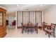 Bright dining room adjacent to the living room featuring tile flooring, and shoji screen at 8569 Sw 92Nd Ln # F, Ocala, FL 34481