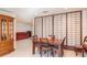 Dining room featuring a wood table, tile flooring, and shoji screen at 8569 Sw 92Nd Ln # F, Ocala, FL 34481