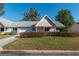 Charming single-story home featuring a well-manicured front yard, attached garage, and inviting entrance at 8569 Sw 92Nd Ln # F, Ocala, FL 34481