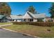 Delightful single-story home featuring a lush lawn, a driveway, attached garage, and a cozy covered porch at 8569 Sw 92Nd Ln # F, Ocala, FL 34481