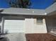 White garage door with house number visible at 8569 Sw 92Nd Ln # F, Ocala, FL 34481