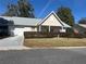 Tan house with gray roof and a neatly trimmed hedge at 8569 Sw 92Nd Ln # F, Ocala, FL 34481