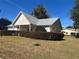 Tan house with gray roof and a well-maintained lawn at 8569 Sw 92Nd Ln # F, Ocala, FL 34481