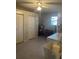 Laundry room with washer, dryer, storage cabinets, and a bicycle at 8569 Sw 92Nd Ln # F, Ocala, FL 34481