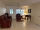 Living room with tiled floors, a recliner, and a sofa at 8569 Sw 92Nd Ln # F, Ocala, FL 34481