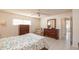 Bright bedroom featuring tiled floors, a ceiling fan, and stylish furnishings at 8569 Sw 92Nd Ln # F, Ocala, FL 34481