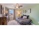 Bedroom with a daybed, dresser, and view of a playground at 8693 Sw 44Th Ter, Ocala, FL 34476