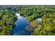 Aerial view showing a tranquil river winding through a verdant forest at 9185 Sw 197Th Cir, Dunnellon, FL 34432