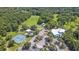 Aerial view of community amenities including tennis courts, pool, and clubhouse at 9185 Sw 197Th Cir, Dunnellon, FL 34432