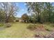 Open backyard with mature trees and landscaping at 9185 Sw 197Th Cir, Dunnellon, FL 34432