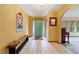 Spacious entryway with terracotta tile flooring and teal door at 9185 Sw 197Th Cir, Dunnellon, FL 34432