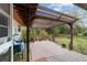 Covered patio with pergola, ideal for outdoor relaxation at 9185 Sw 197Th Cir, Dunnellon, FL 34432