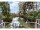 Steps leading down to a refreshing river, surrounded by lush greenery at 9185 Sw 197Th Cir, Dunnellon, FL 34432