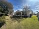 Front view of the house with lawn at 9581 Se 168Th Elderberry Pl, The Villages, FL 32162