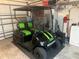 Black golf cart with green accents at 9581 Se 168Th Elderberry Pl, The Villages, FL 32162