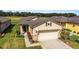 Single-story house with tan siding and a gray roof at 9661 Sw 63Rd Loop, Ocala, FL 34481