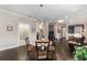 Casual dining area with a round table and four chairs, adjacent to the living room at 9661 Sw 63Rd Loop, Ocala, FL 34481